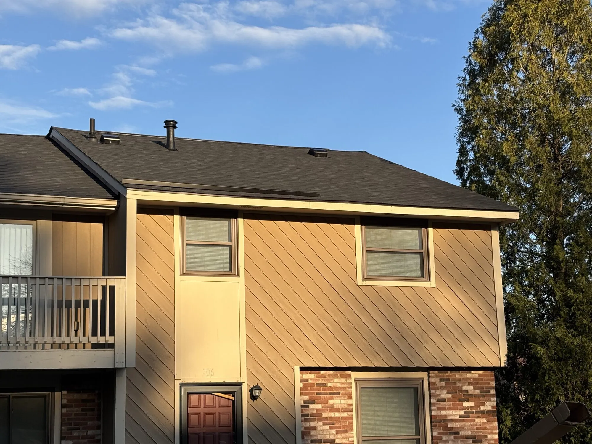 Townhome Exterior. Roofing & Siding project by West Penn Exteriors.